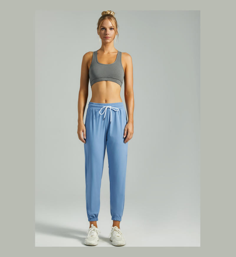 Women's blue jogger pants with drawstring waist and elastic cuffed ankles
