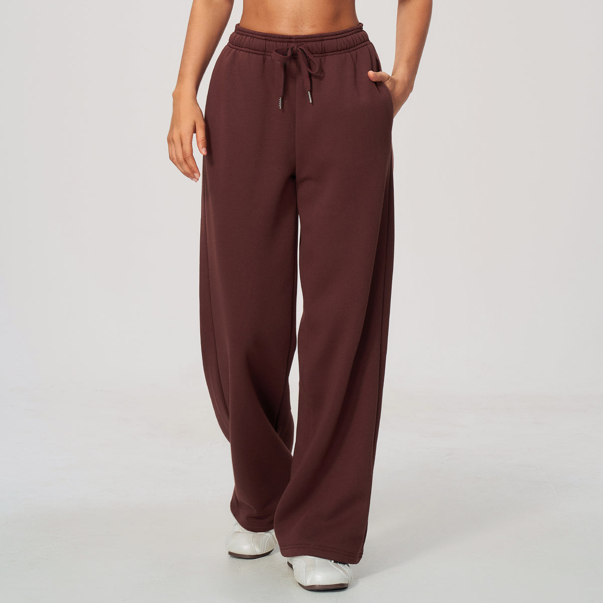 Burgundy high-waisted sweatpants with elastic waistband and drawstring, wide legs