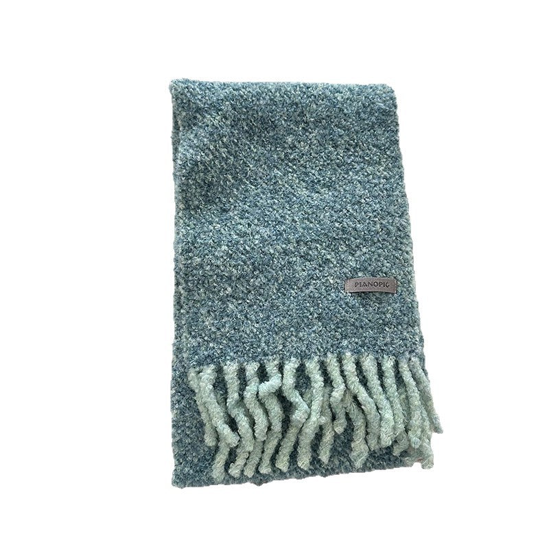 Folded chunky loop-knit scarf shawl in teal-blue with fringe and woven brand label