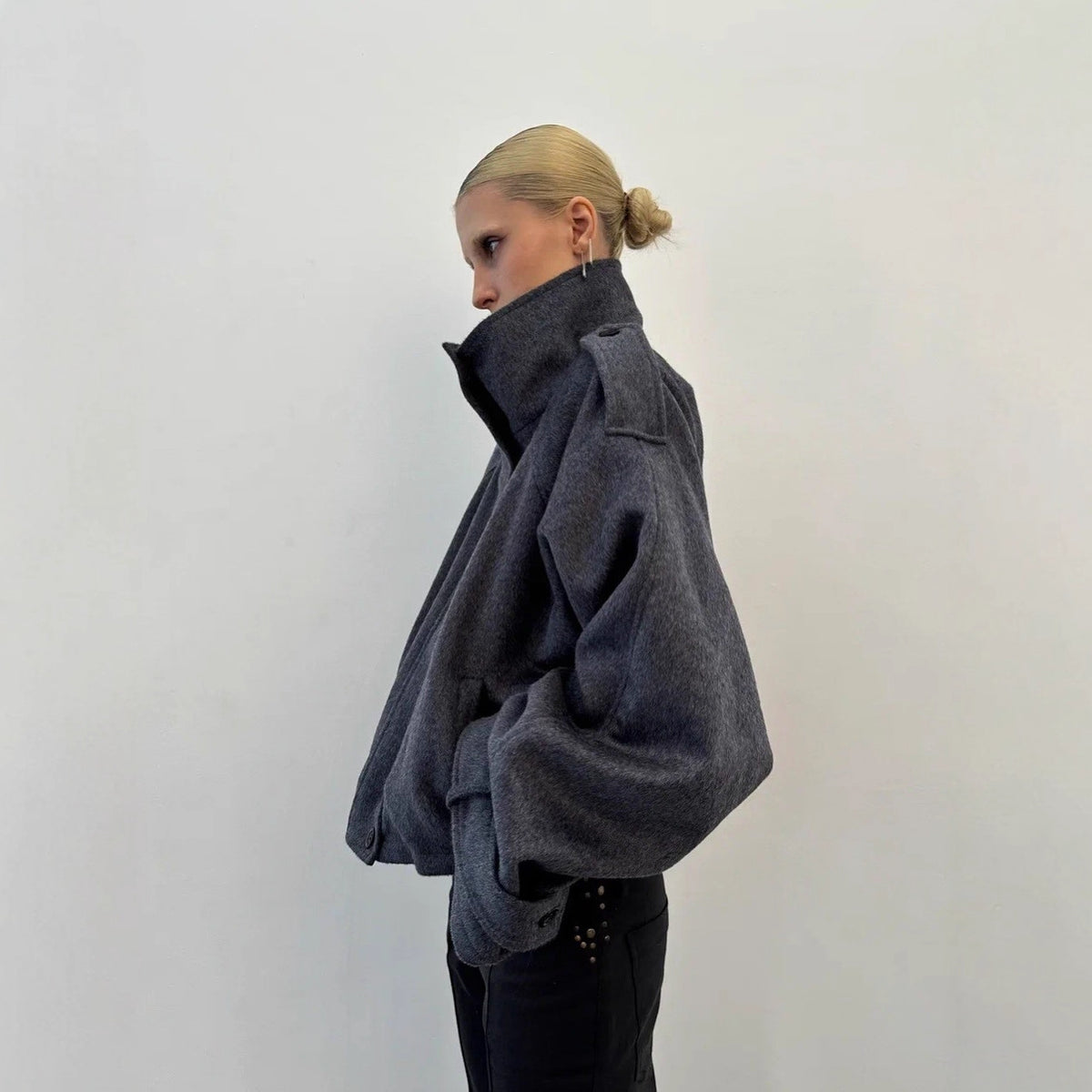 Gray wool jacket with stand-up collar, snap buttons, loose wide sleeves.