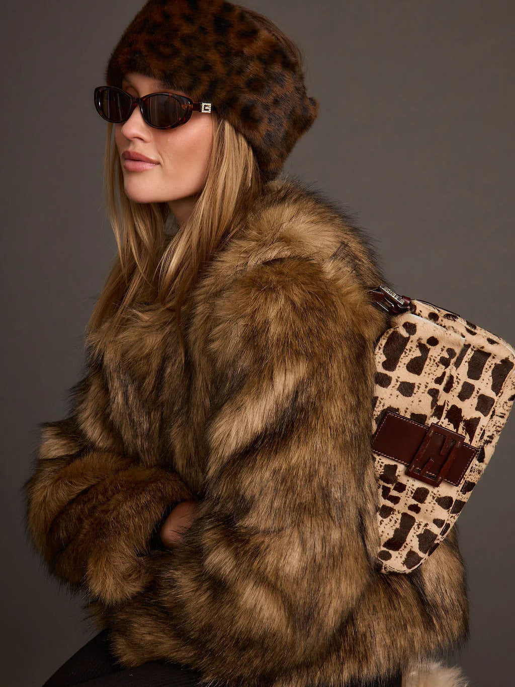 Brown faux fur short coat with plush, wavy texture and wide collar