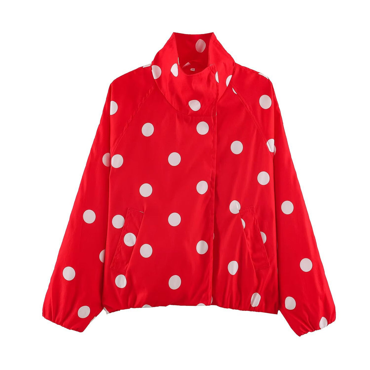 Red polka-dot bomber jacket with zip front and long sleeves