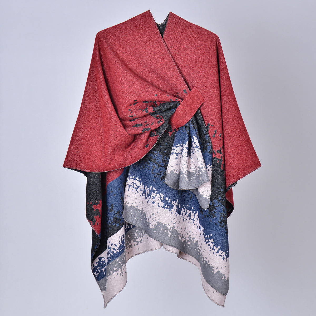 Faux cashmere print shawl, red top with black and navy splash pattern, draped design.