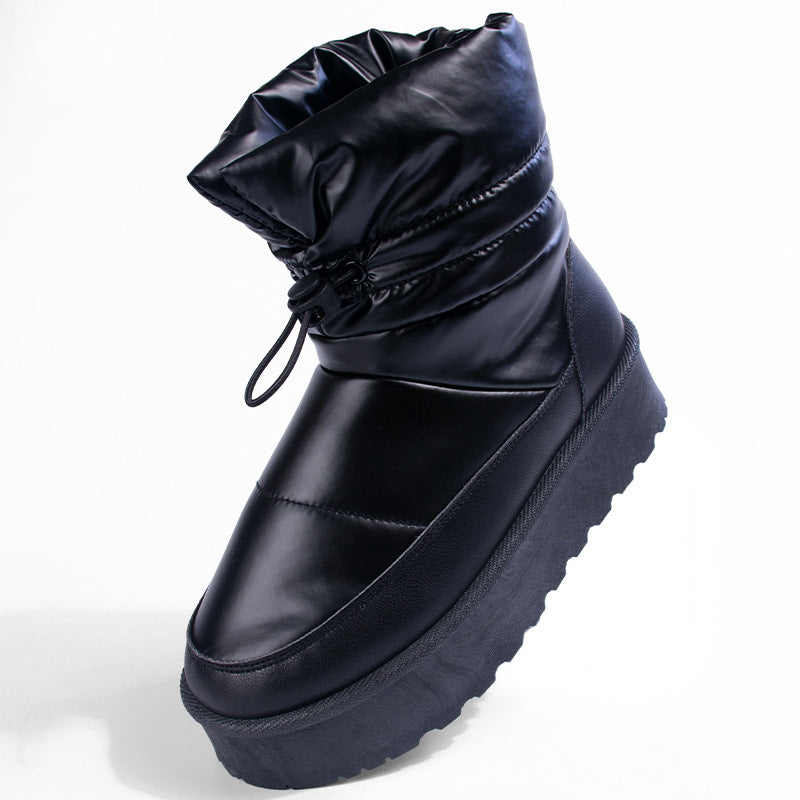 Women's black mid-top snow boot with lace tie, chunky platform sole