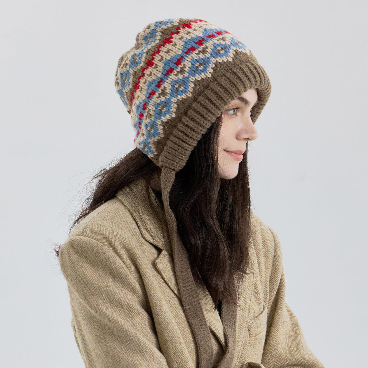 Fair Isle knit beanie with ribbed cuff and multicolor pattern, blue and red accents