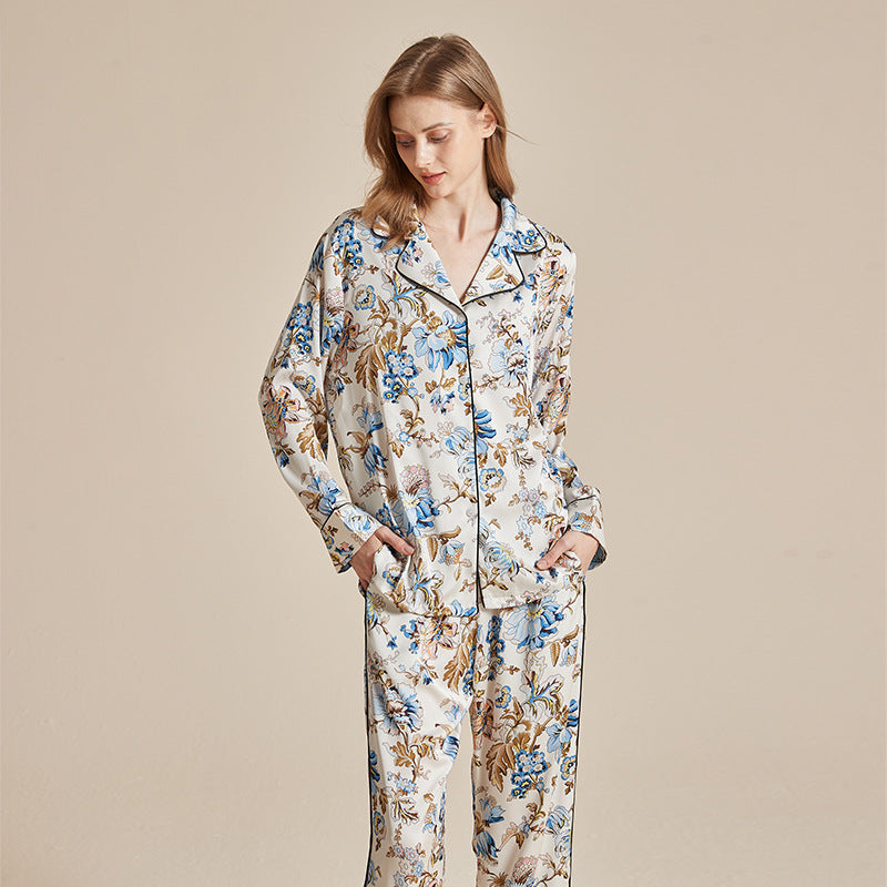 Women’s long-sleeve printed pajama set with blue and gold floral motifs on cream