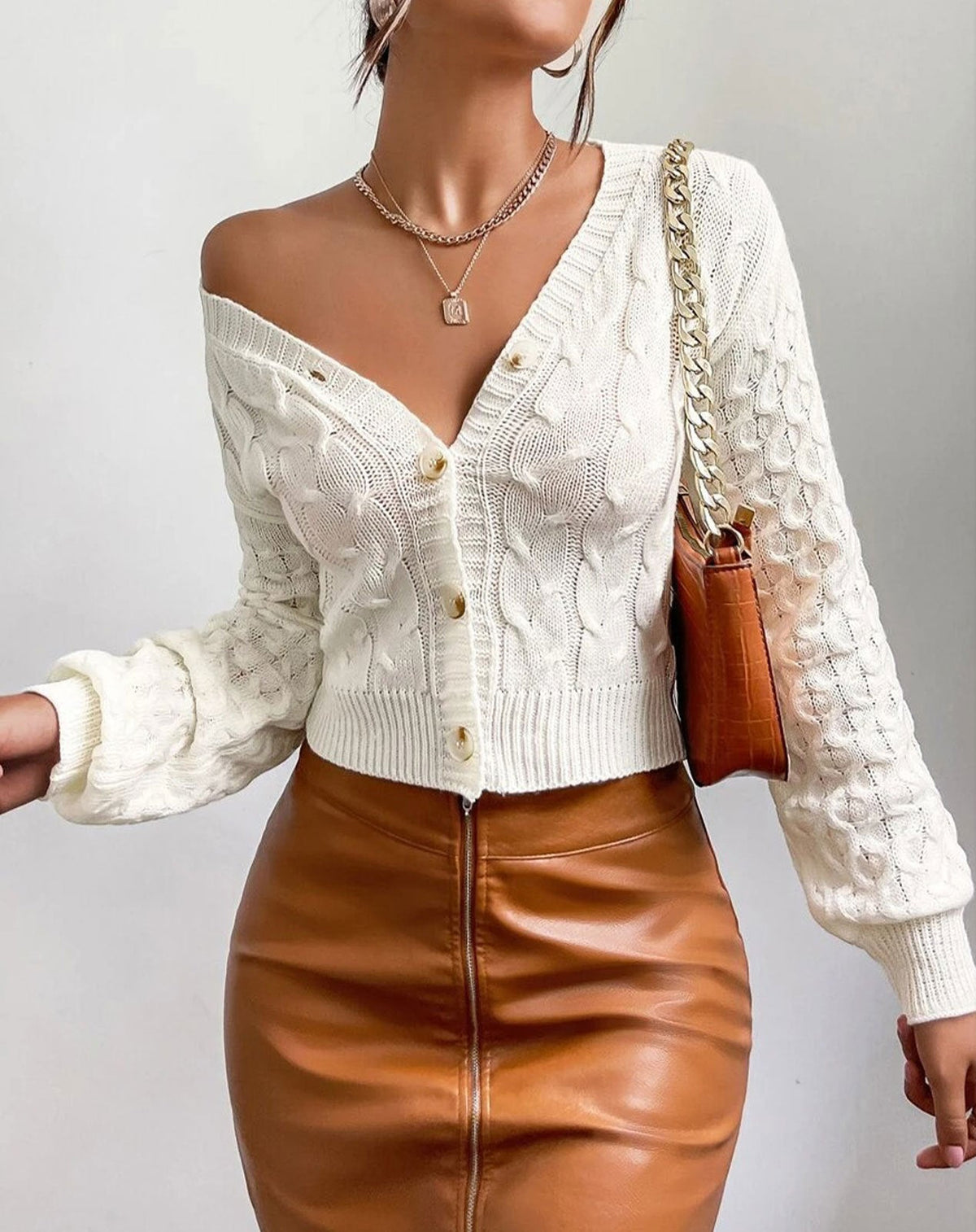 Milky white v-neck cable-knit cardigan with front buttons and textured sleeves