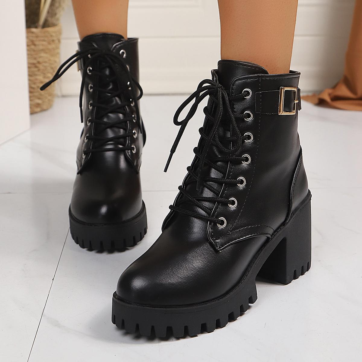 Women’s black lace-up ankle boots with round toe, chunky block heel, and metal buckle