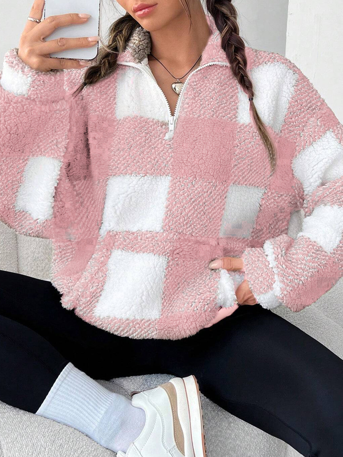 Pink and white plaid fuzzy quarter-zip sweatshirt with half-open collar, long sleeves