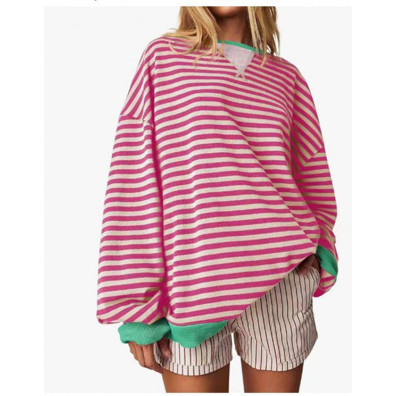 Women’s striped pullover sweatshirt with long sleeves and round neckline, pink and purple.