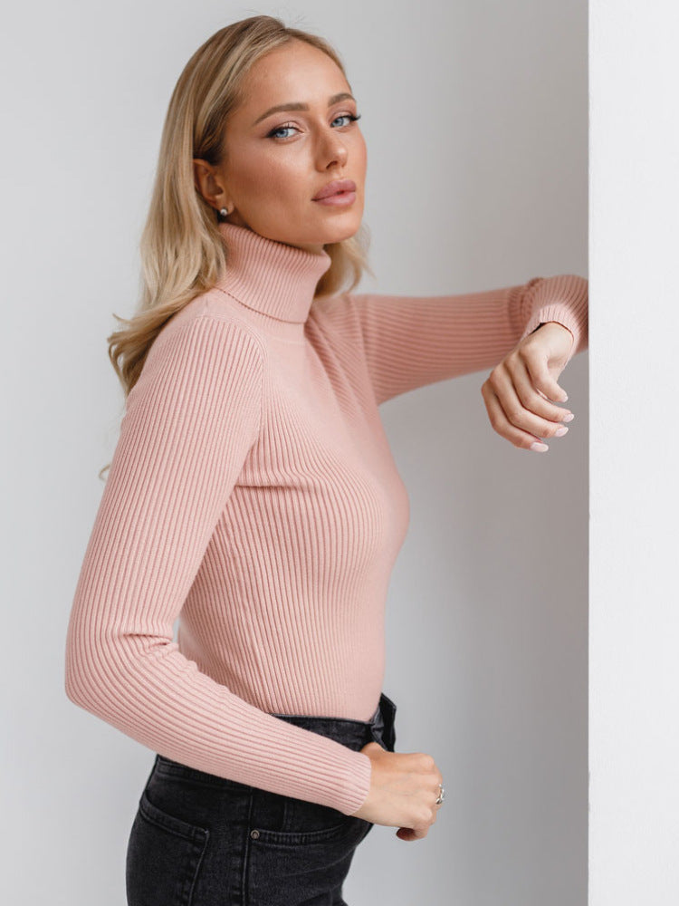 Blush pink ribbed turtleneck sweater, fitted long sleeves
