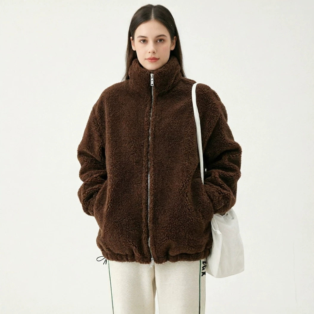 Women’s brown sherpa full-zip coat with stand collar, long sleeves, and side pockets