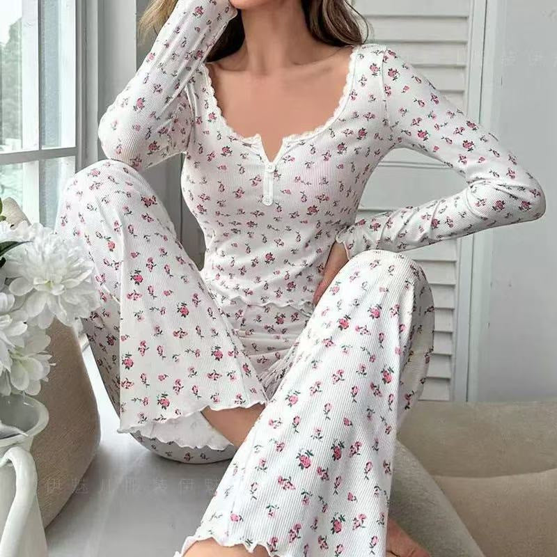 Women’s white floral pajama set with long sleeves, button front, and matching long pants