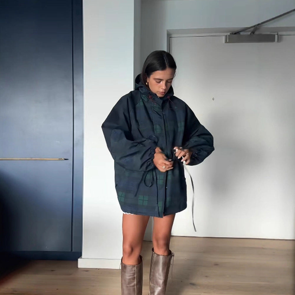 Dark blue hooded windbreaker with stand collar and green plaid panels, drawstring waist