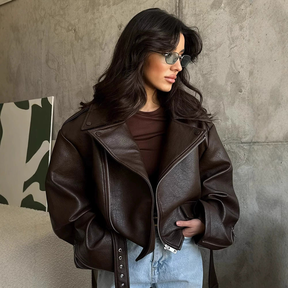 Women's brown short leather motorcycle jacket, zip front and lapel with snap cuffs