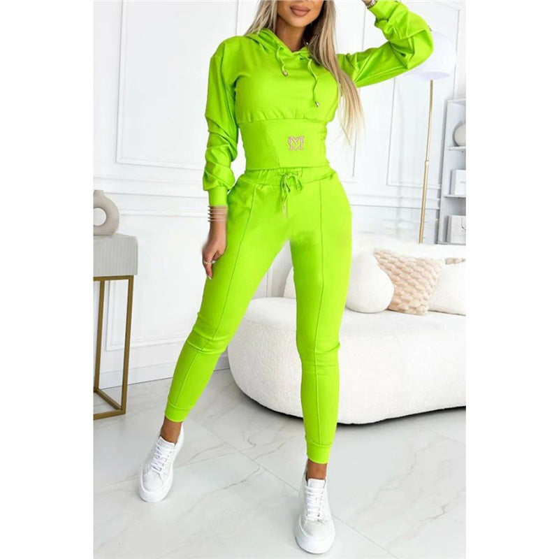 Neon green hooded top and long jogger pants set, drawstring waist and front logo.