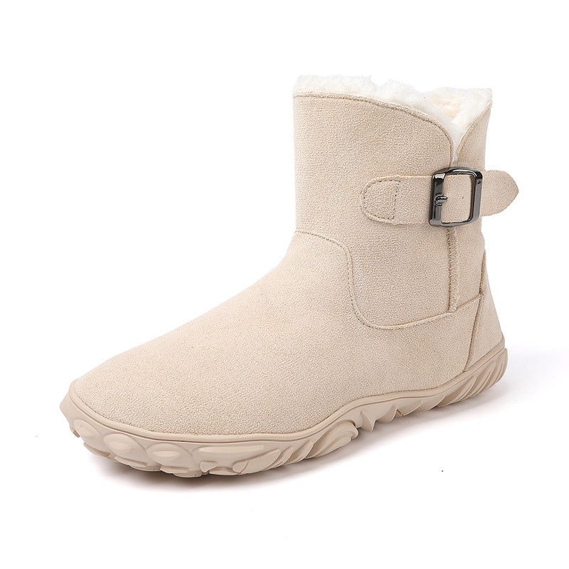 Light beige flat ankle snow boot with faux fur collar and side buckle strap, rugged sole