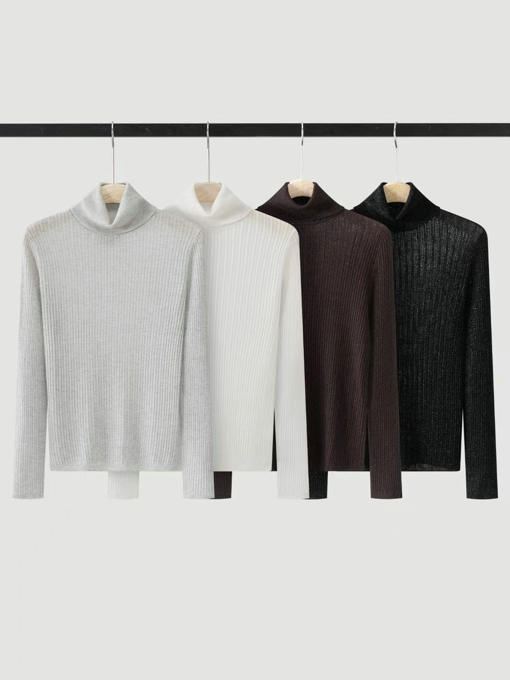 Assorted high-neck knit sweaters on hangers: light gray, white, brown, black
