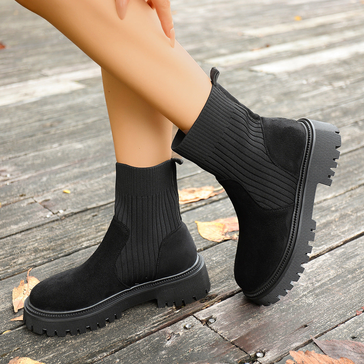 Black knit sock ankle boots with thick lug sole and side elastic knit
