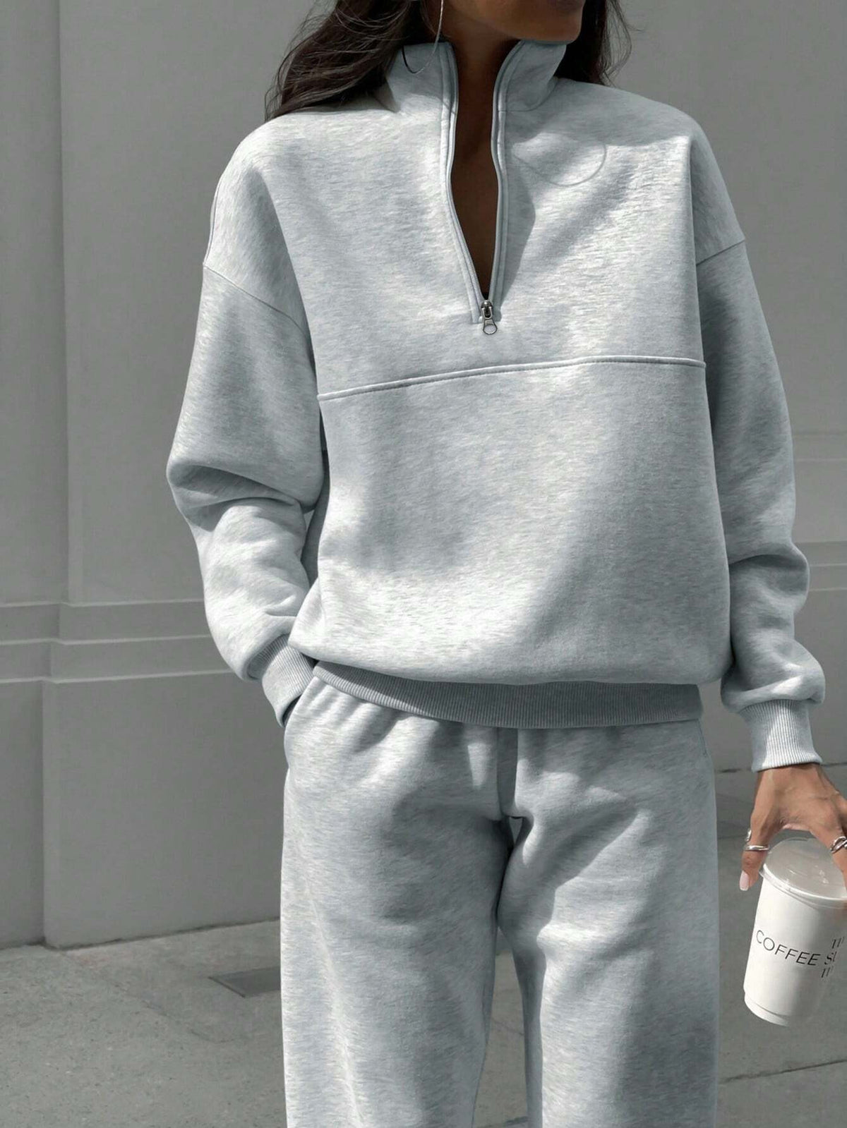 Light gray zip-lapel two-piece tracksuit set with quarter-zip pullover and tapered joggers