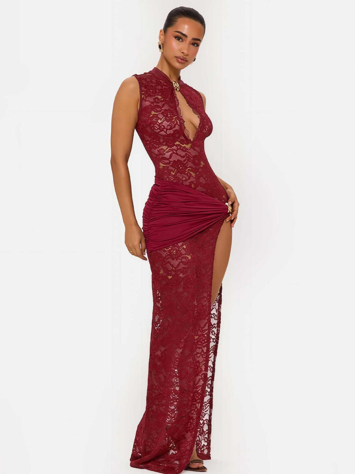Red lace long dress with sleeveless mock-neck and high-slit lace overlay skirt.