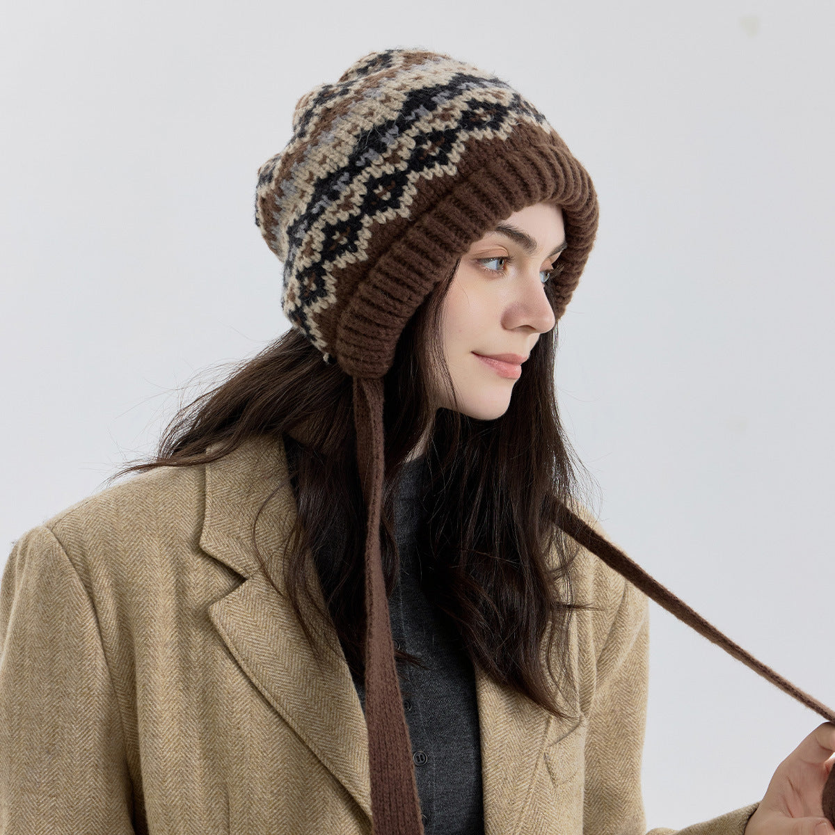 Fair Isle knit beanie with ribbed cuff and long tie strap, brown and cream fleck pattern