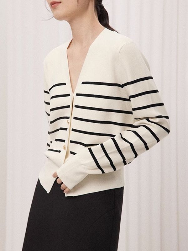 Women’s cream knit sweater with black stripes, V-neckline and button-front closure