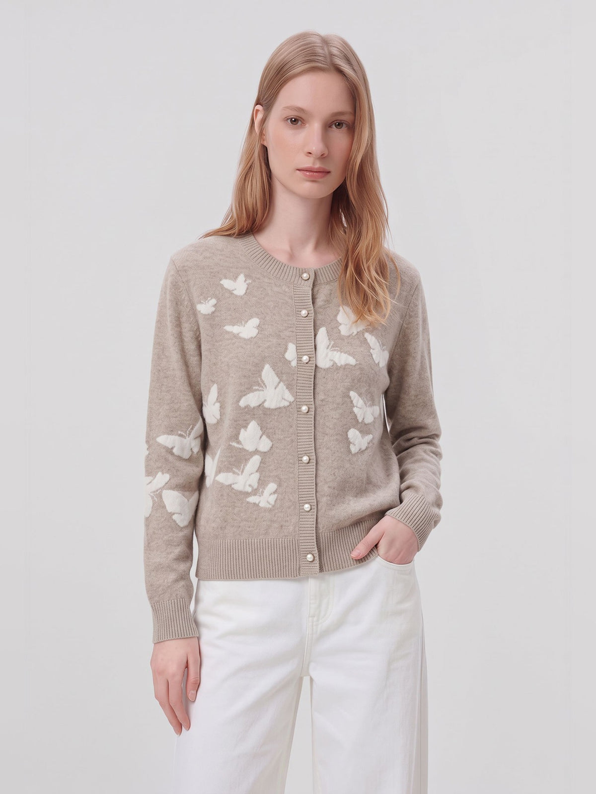 Women’s sand button-front cardigan sweater with scattered white butterfly motifs