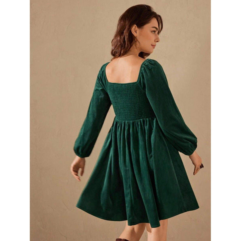 Dark green corduroy square-neck lantern-sleeve mini dress, back view