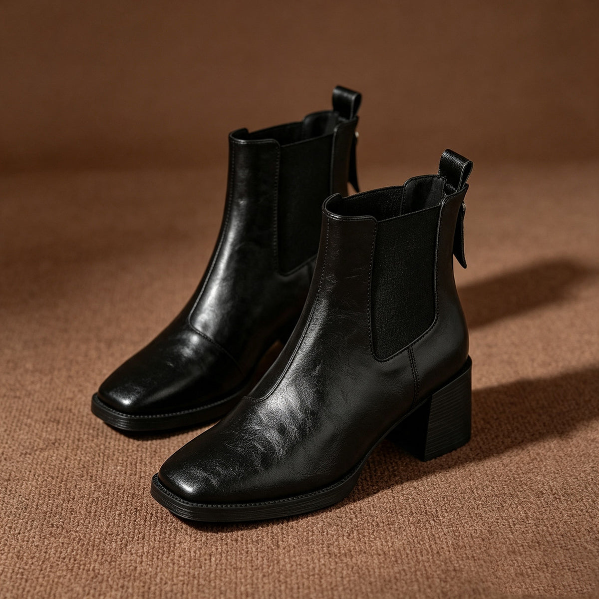 Black Chelsea short boots with square toe, elastic side panels and chunky block heel.