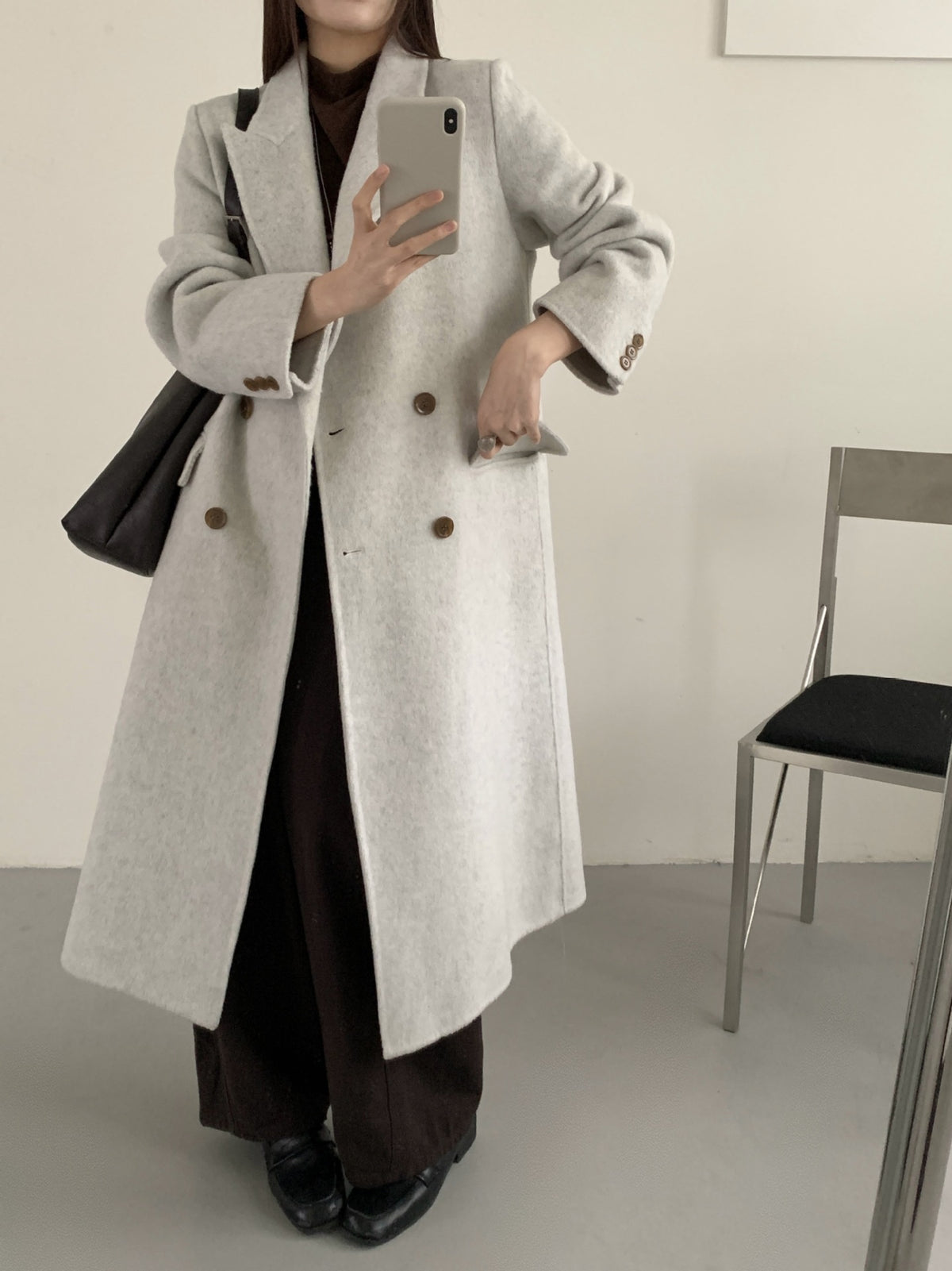 Light-gray long double-breasted cashmere coat with notched lapel and double button row