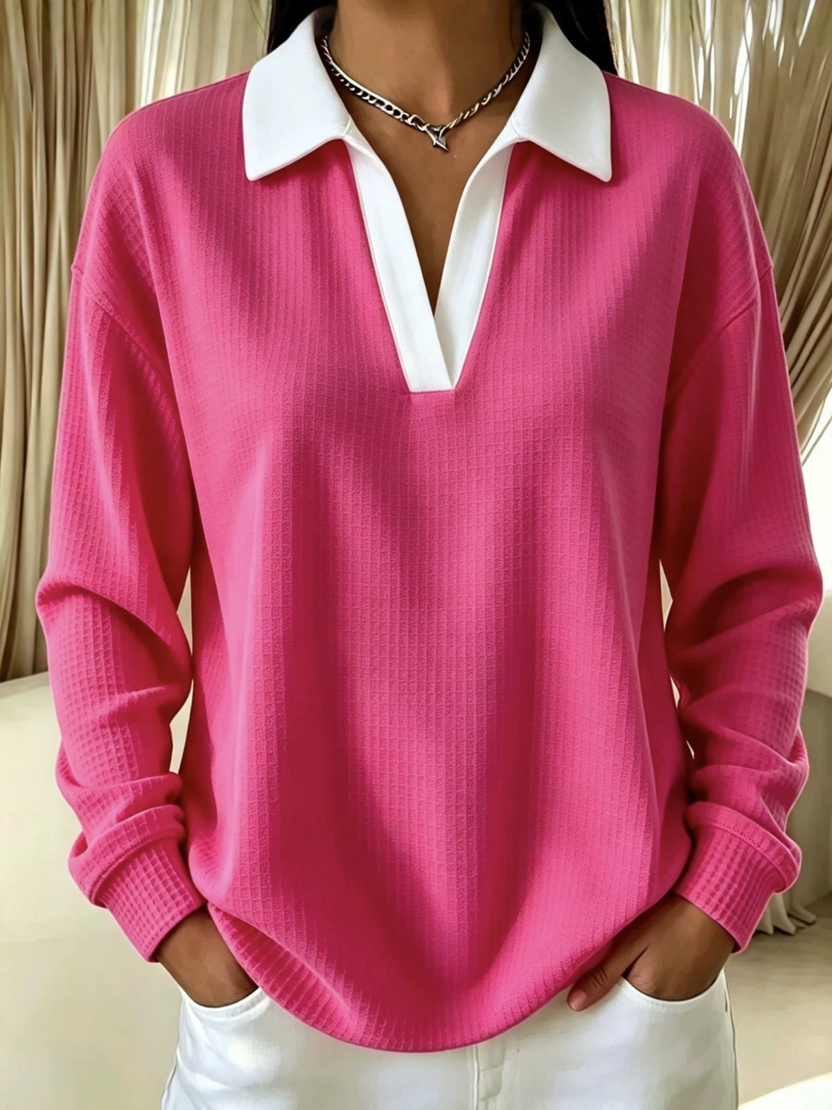 Pink waffle-knit V-neck long-sleeve polo shirt with white contrast collar and placket