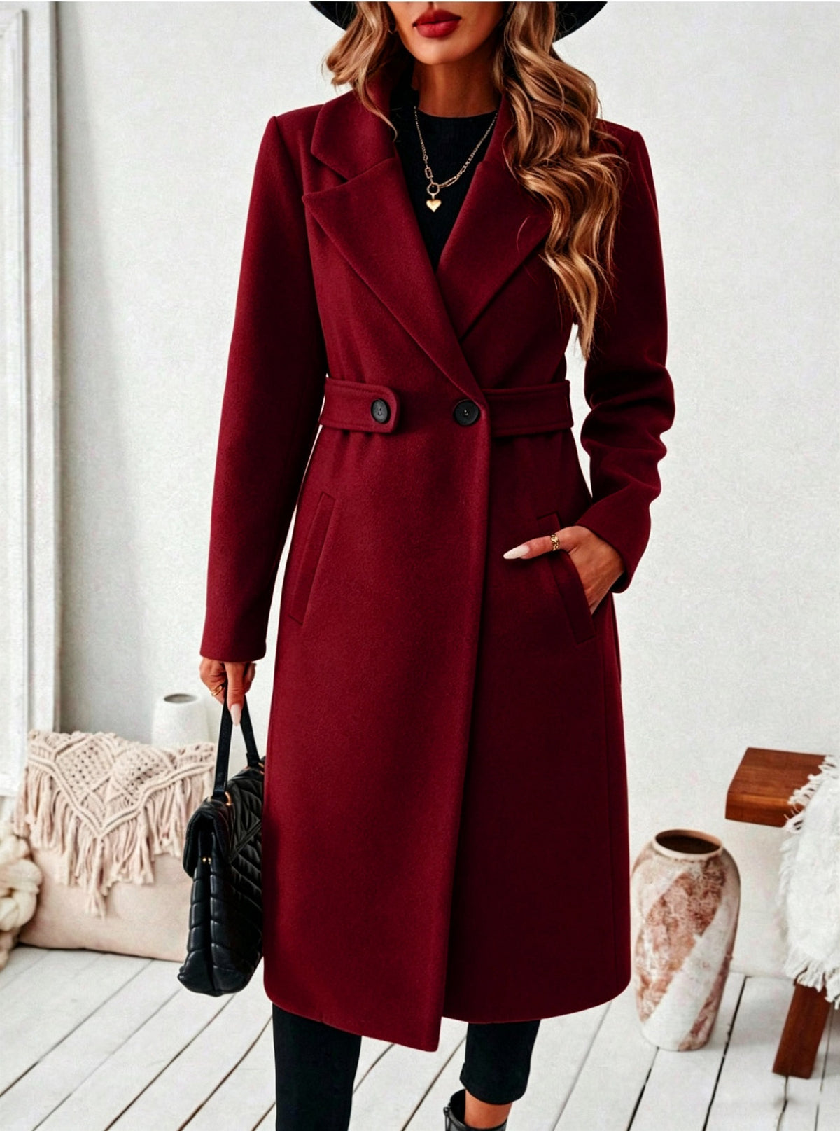 Wine red wool long double-breasted coat with notched lapels, waist belt, and flap pockets.