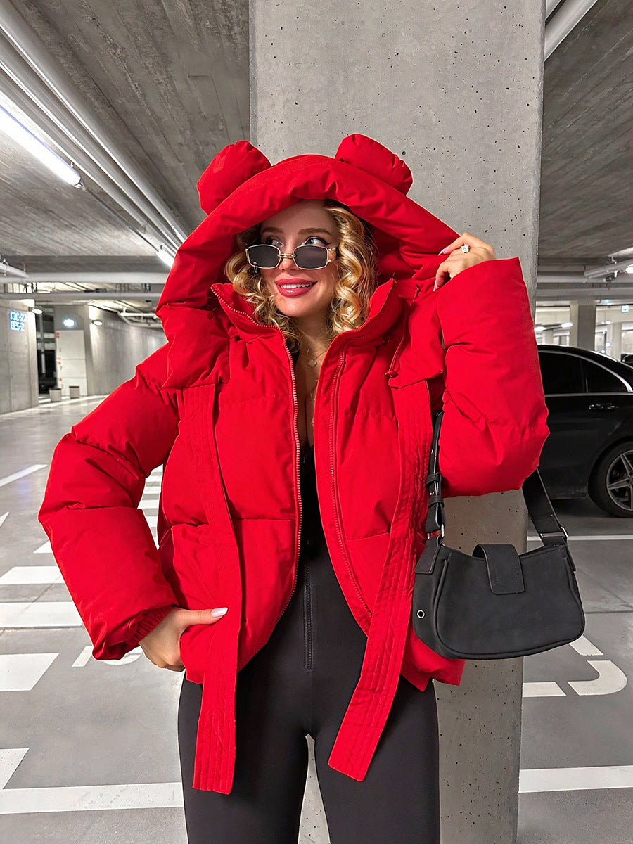 Red padded hooded jacket with rounded ear details and long drawstrings.