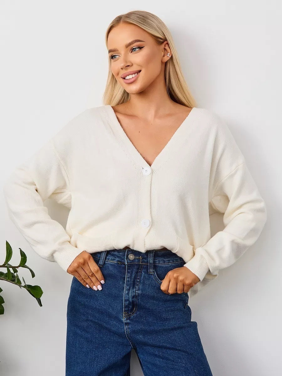 Women's white knit V-neck cardigan with button front and front pockets, long sleeves