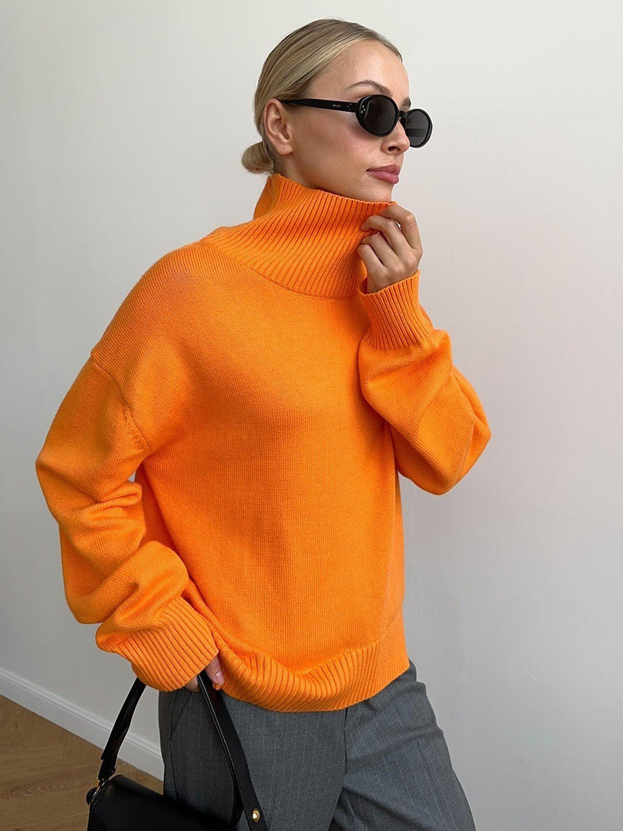 Loose turtleneck knit sweater in orange, ribbed turtleneck and hem, relaxed fit.