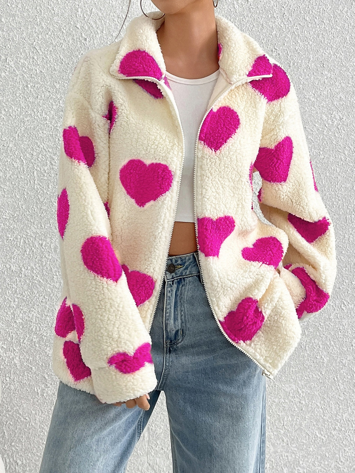 Cream plush zip-up cardigan with pink heart pattern, long sleeves, sherpa-style collar