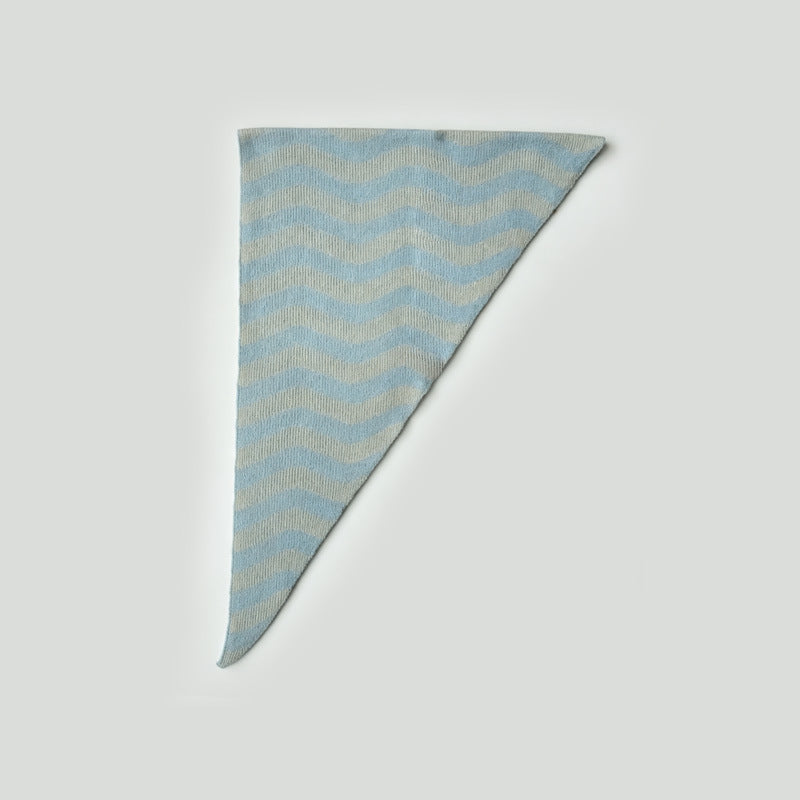 Triangle knit scarf, close-up, wavy stripes in pale blue