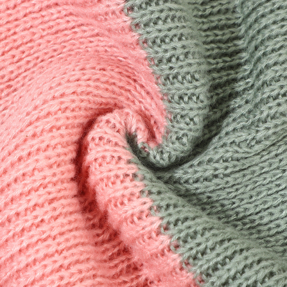 Knitted scarf detail with pink and gray-green stripe pattern