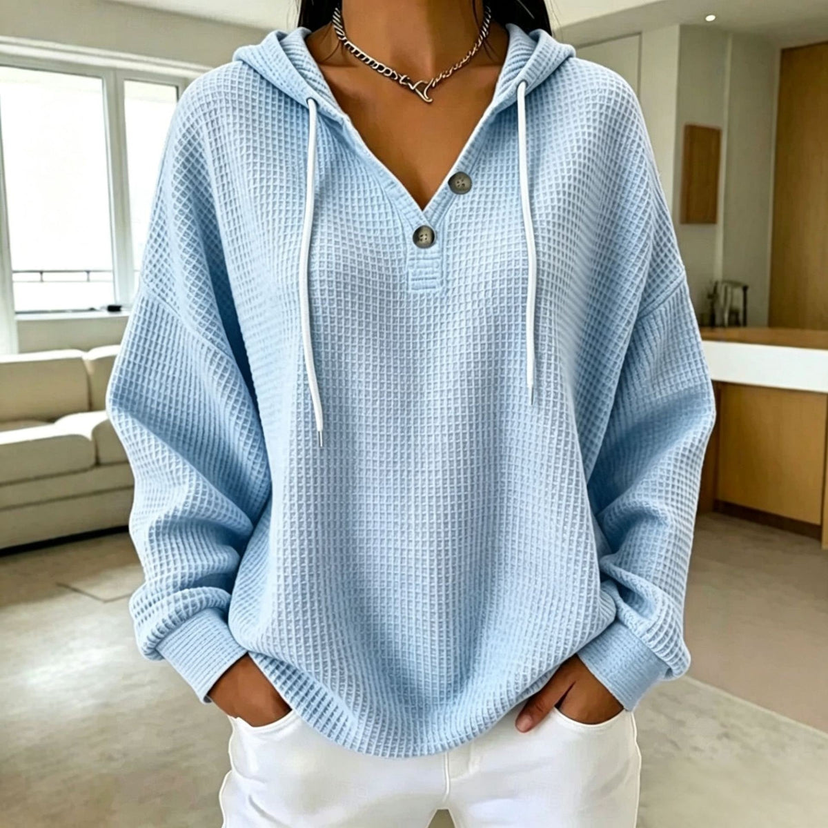 Women\u2019s waffle-knit drawstring hoodie with henley button placket, light blue hood and long sleeves