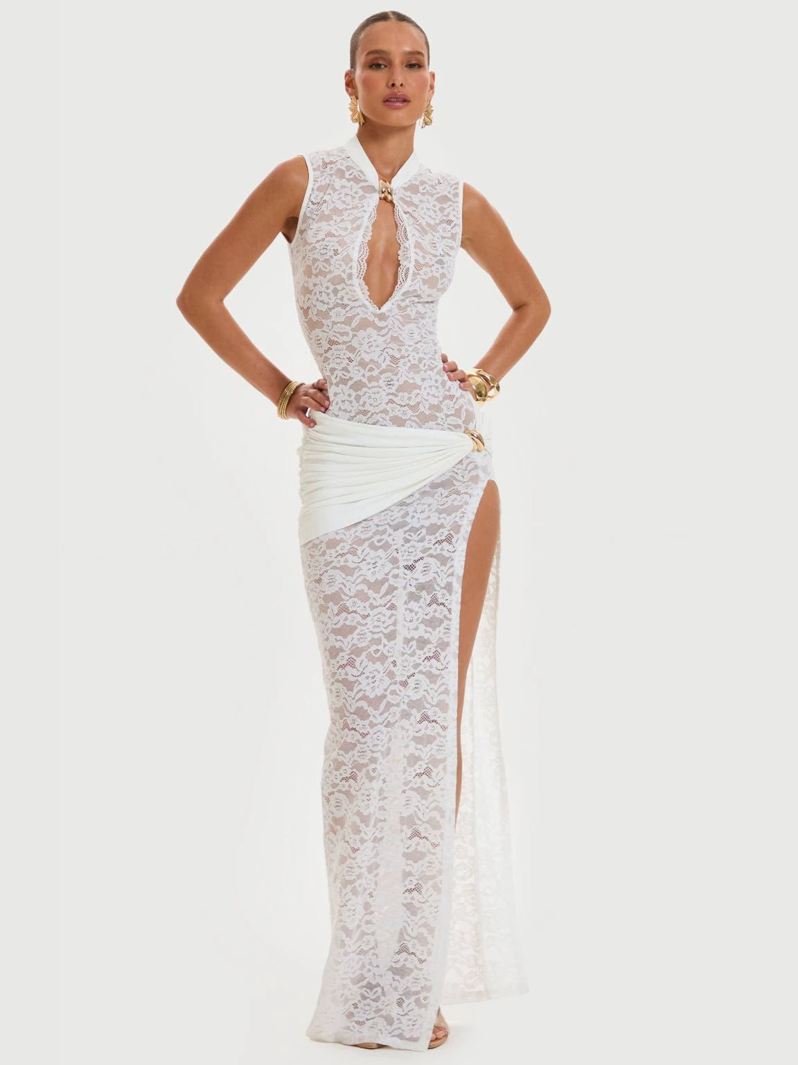 White lace long dress, sleeveless high neck with keyhole, thigh-high side slit.