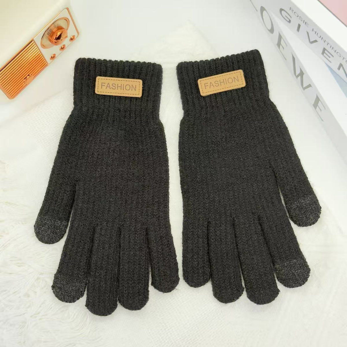 Dark gray knitted winter gloves with ribbed cuffs and five finger openings