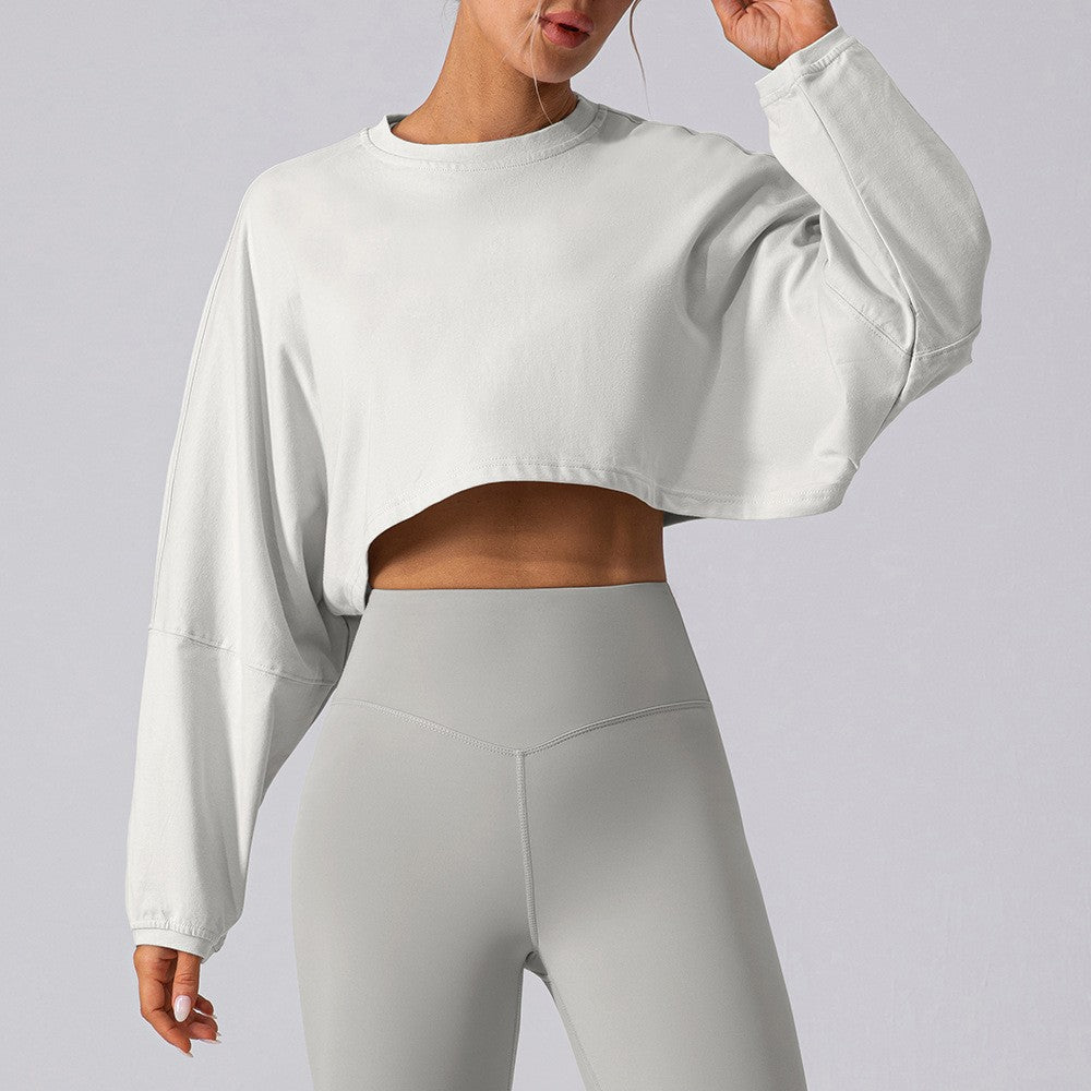 Women's white cropped sweatshirt with dropped shoulders, long sleeves, loose fit