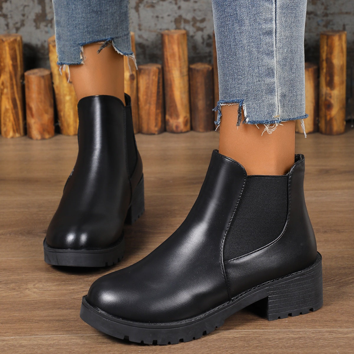 Black pull-on Chelsea ankle boots with rounded toe, elastic side gores, and chunky block heel