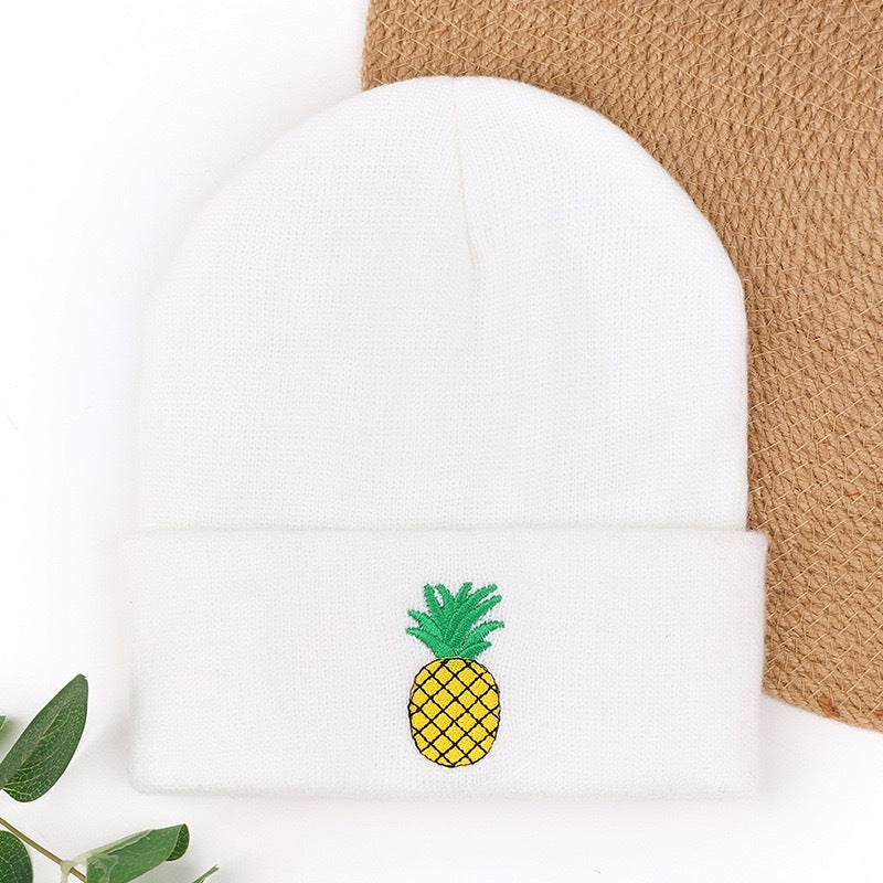 White knit beanie with pineapple embroidery on cuff