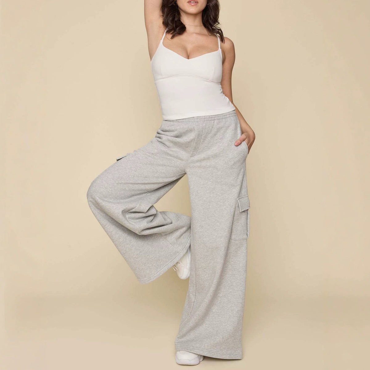 Light gray wide-leg cargo pants with drawstring waist and side cargo pocket detail