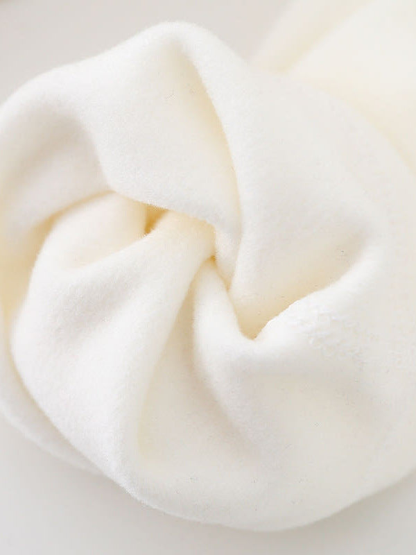 Off-white velvet fabric close-up with soft fuzzy texture