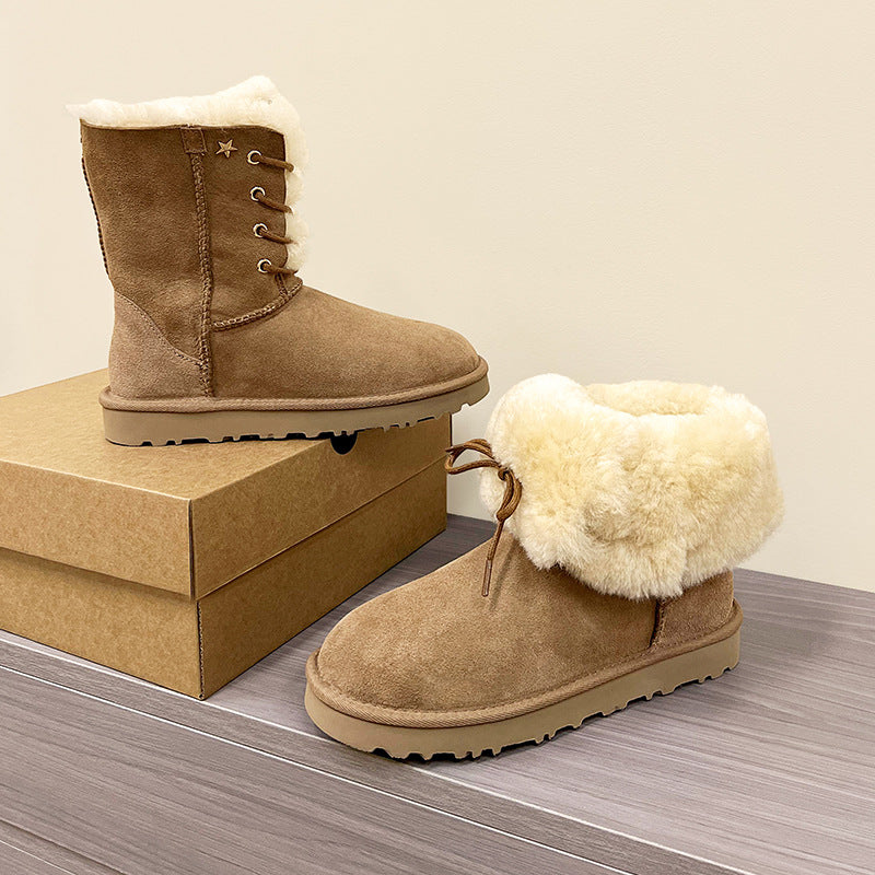 Women’s mid-calf suede boots with cream faux-fur lining, lace-up panel, and star detail