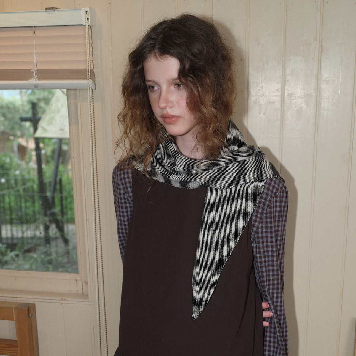 Triangle knit scarf with wavy black-and-white stripes