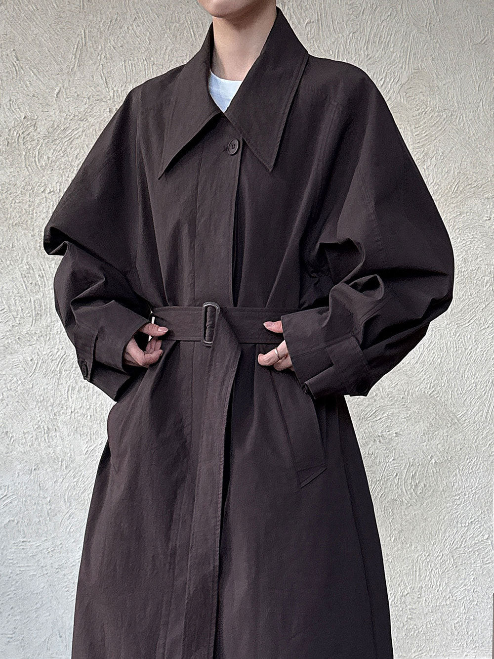 Women’s dark brown lapel trench coat with tie waist and front button placket